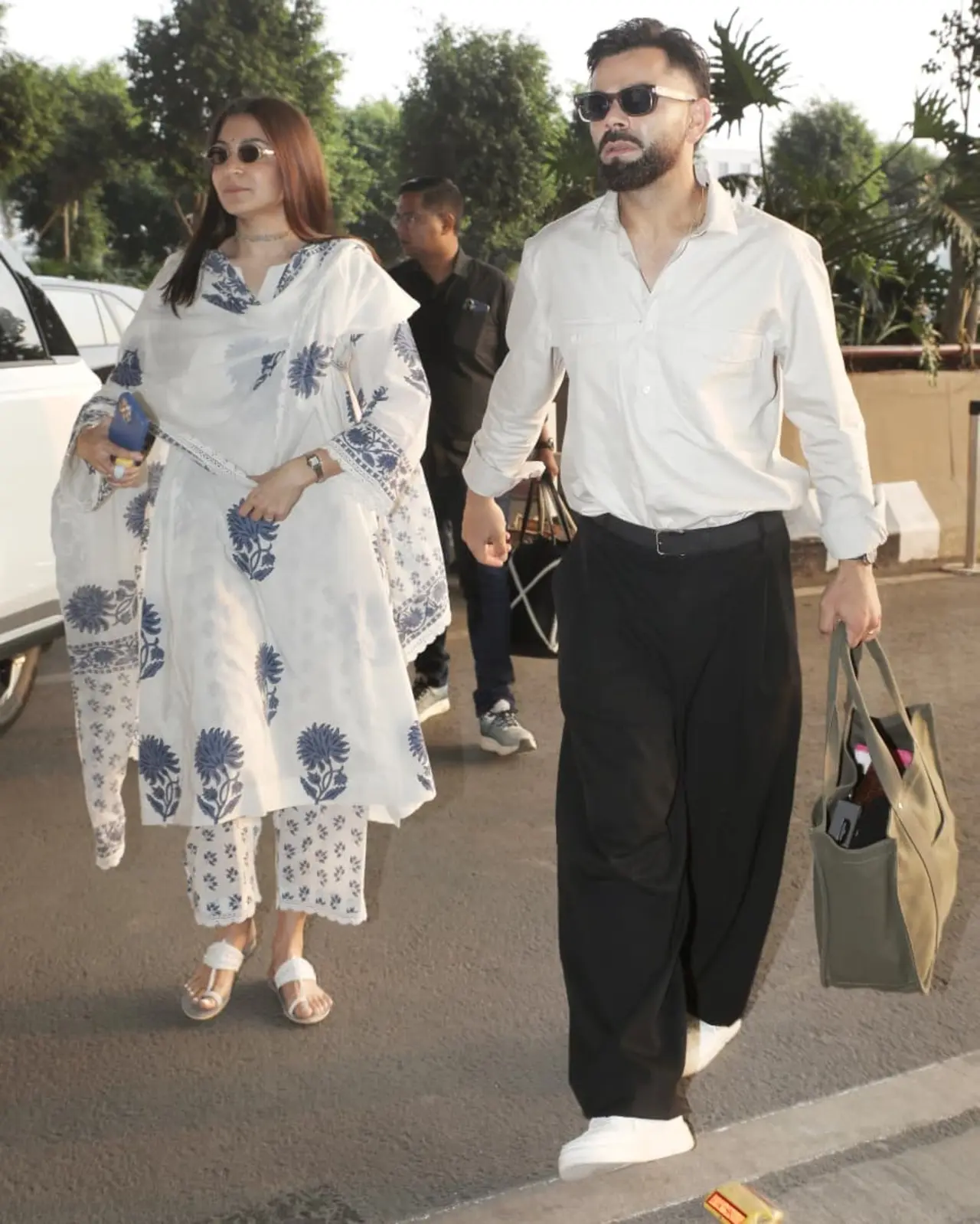 Anushka Sharma and Virat Kohli were spotted at the airport as they jet off twinning in white outfits. 